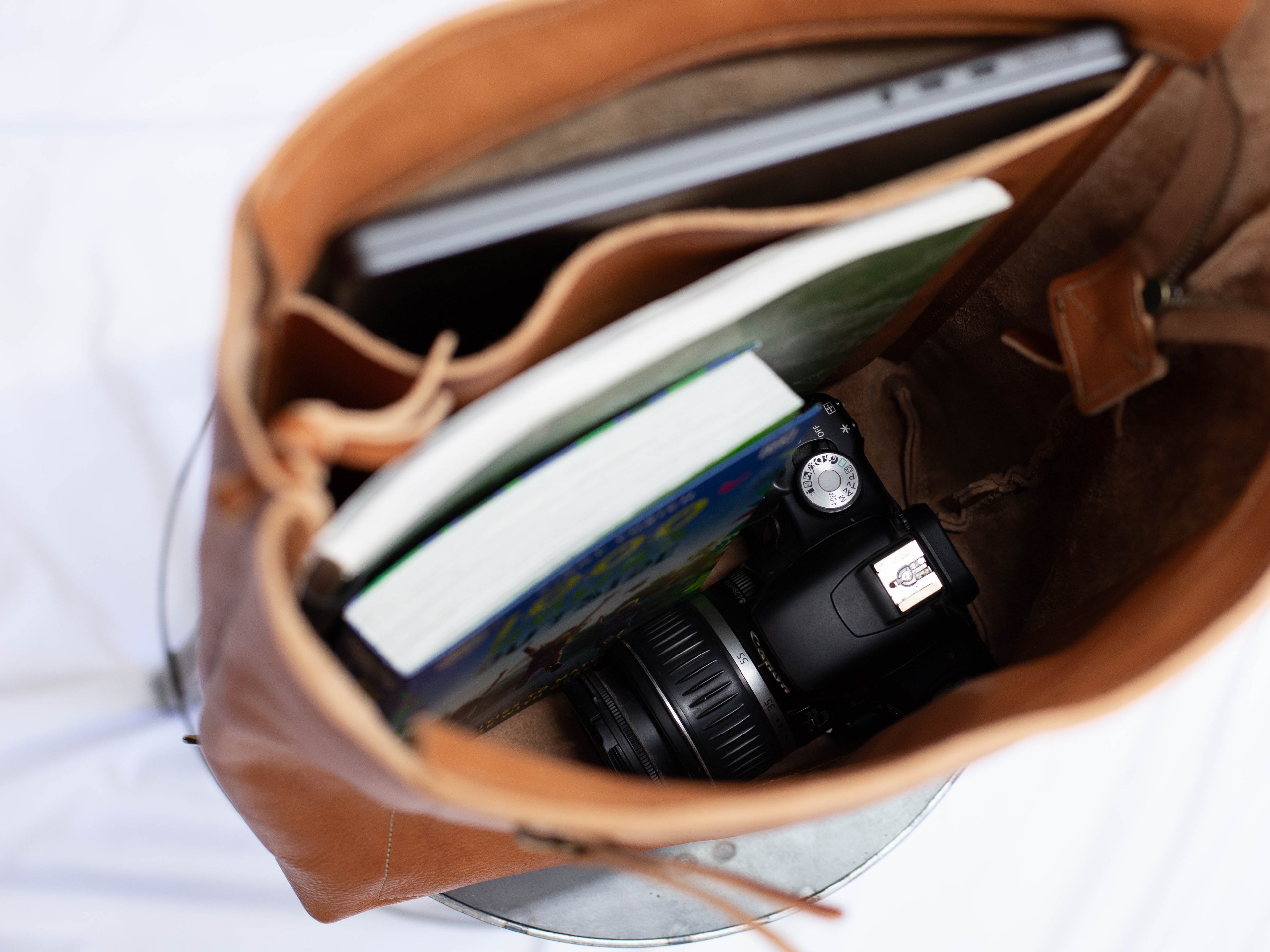 The main compartment is roomy and has space for several books and things like a camera etc., and has an inside pocket for a laptop computer. 