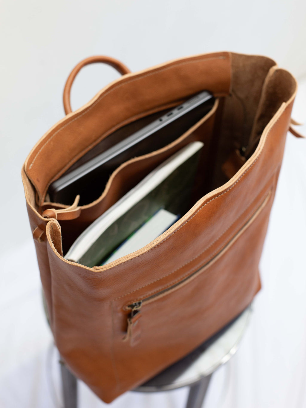 There is an inside pocket in the main compartment for a notebook or laptop up to 15" screen. 