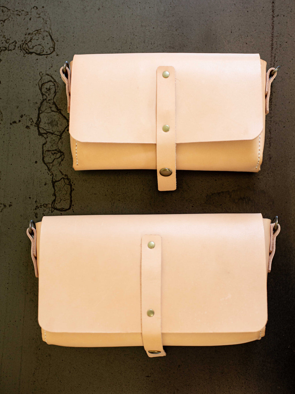 Size comparison between the large convertible fanny pack and the smaller version of the convertible fanny pack.