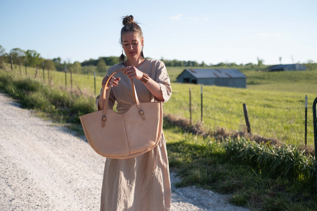 Getting ready to wear the large shoulder bag, made from sustainably sourced, toxin free, veg tanned leather. 