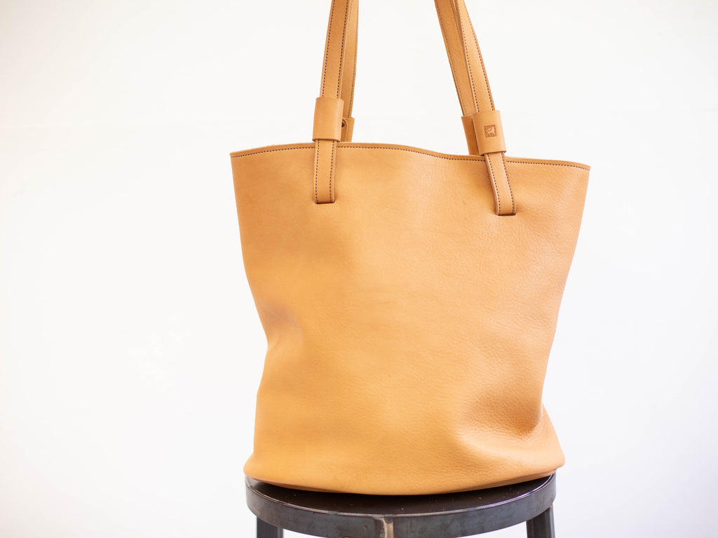 Leather shoulder bag without the optional crossbody strap attachment.