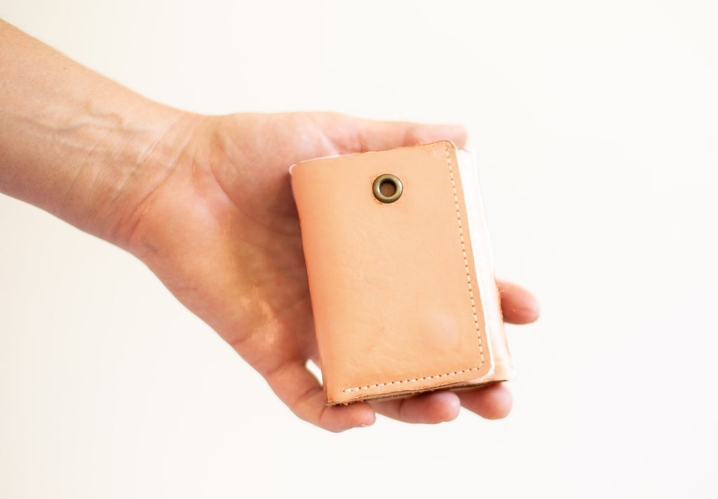 The organic leather card wallet is available with and without an eyelet to attach a chain. 