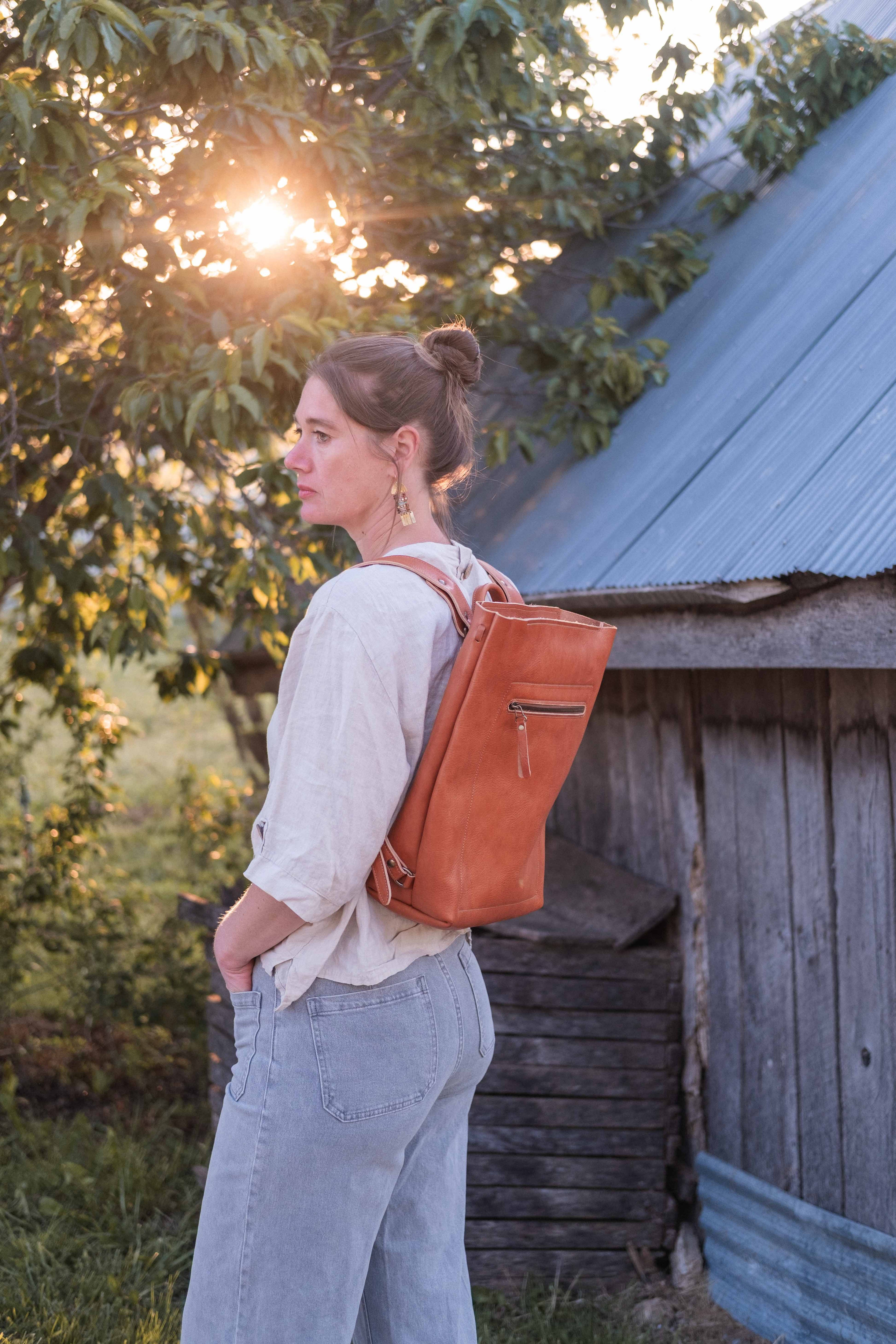 The leather backpack is worn by the owner and maker of White Wolf Leather Studio. 