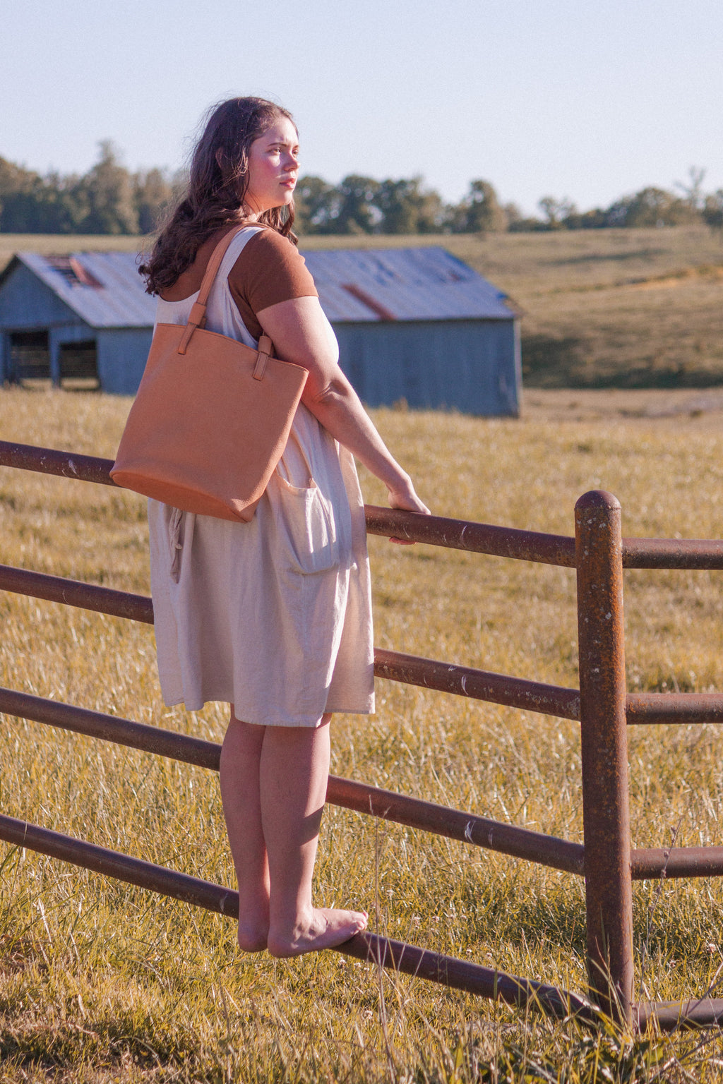 The Leather Shoulder Bag, model "The Gatherer" shown on a model as an example of how the Market Tote looks when in use. 