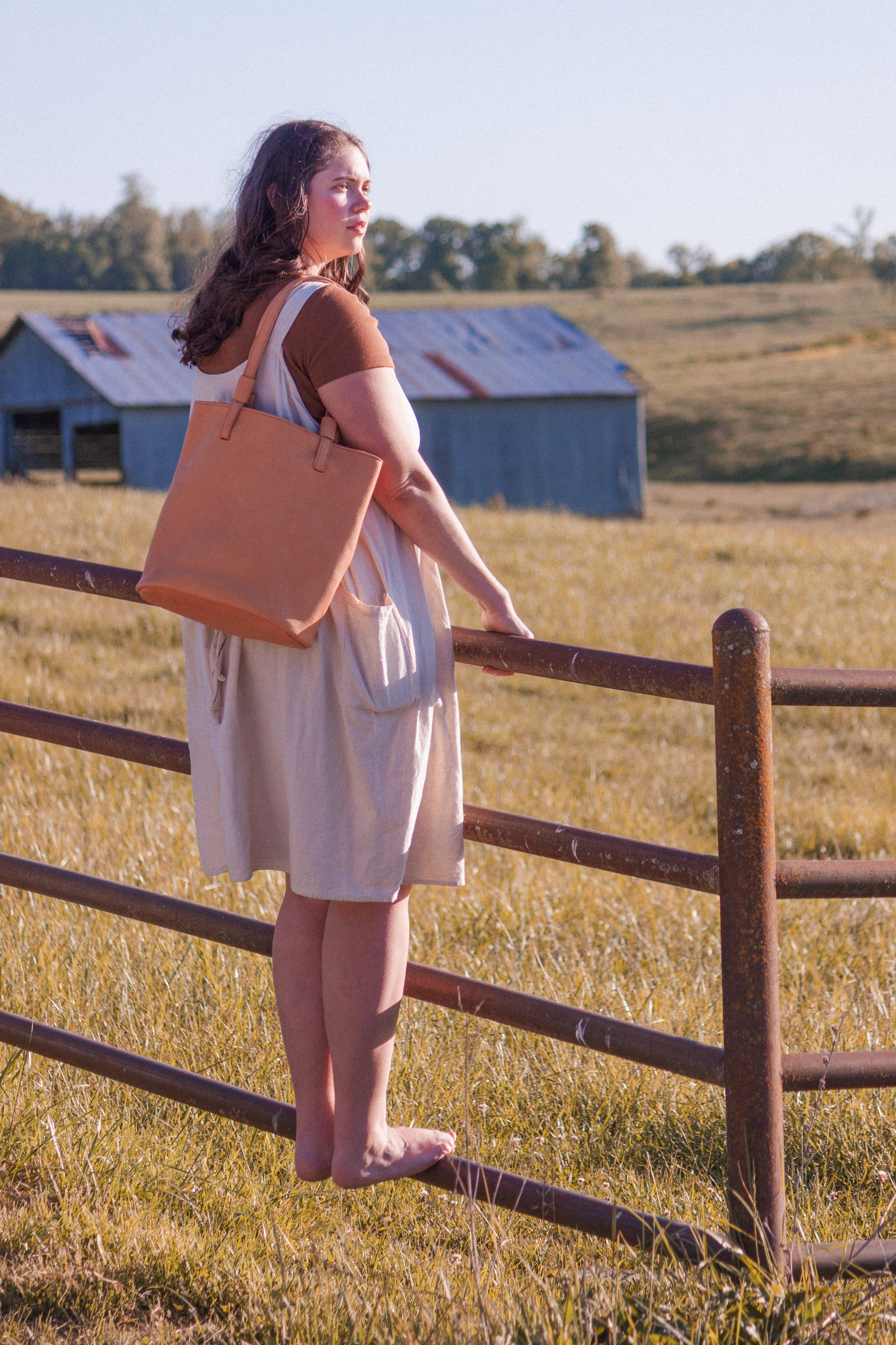 The Leather Shoulder Bag, model "The Gatherer" shown on a model as an example of how the Market Tote looks when in use. 