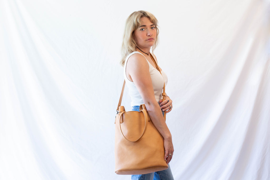 Convertible large leather bag when worn as crossbody bag. 