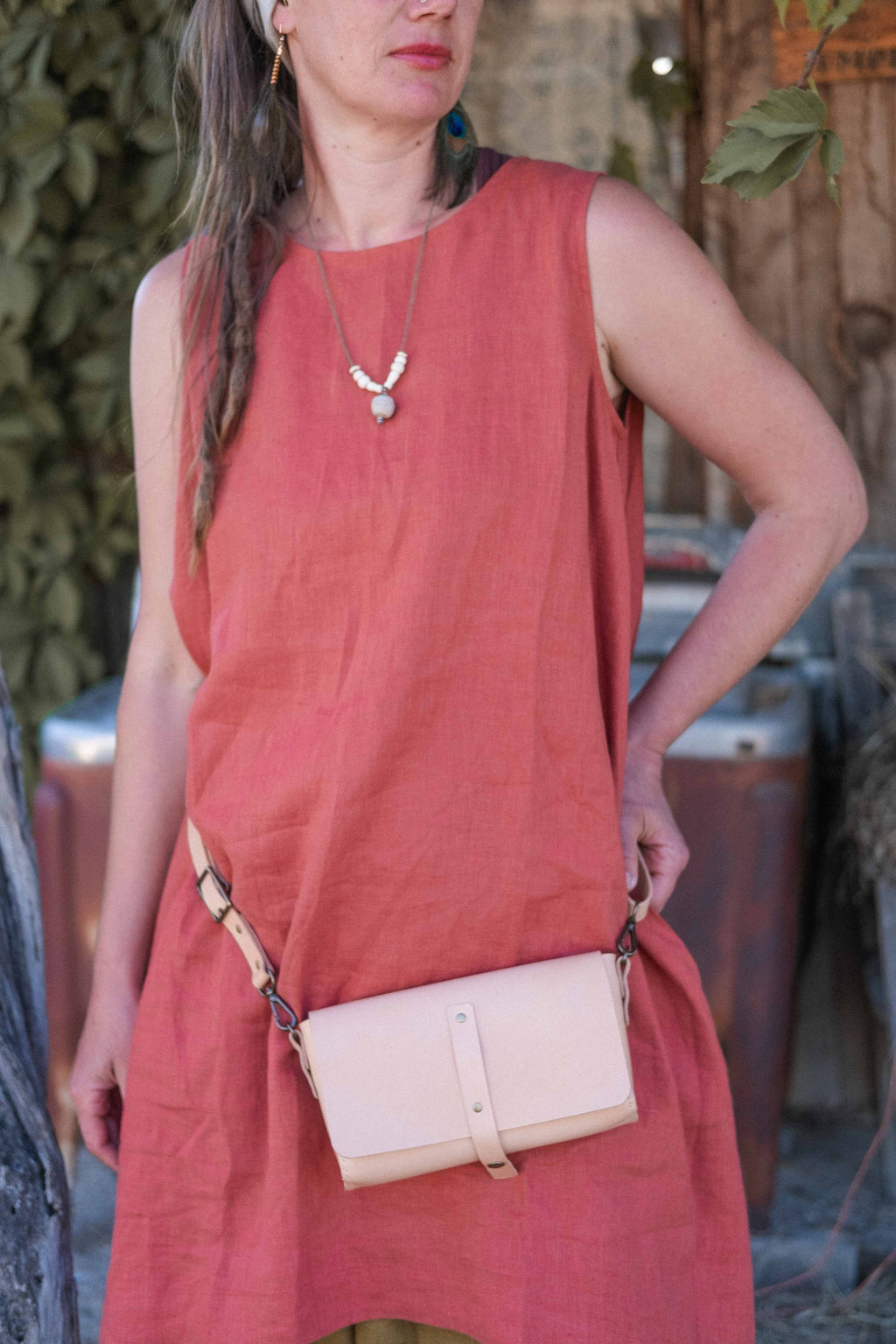A model showing a way to style the sustainable leather fanny pack. 