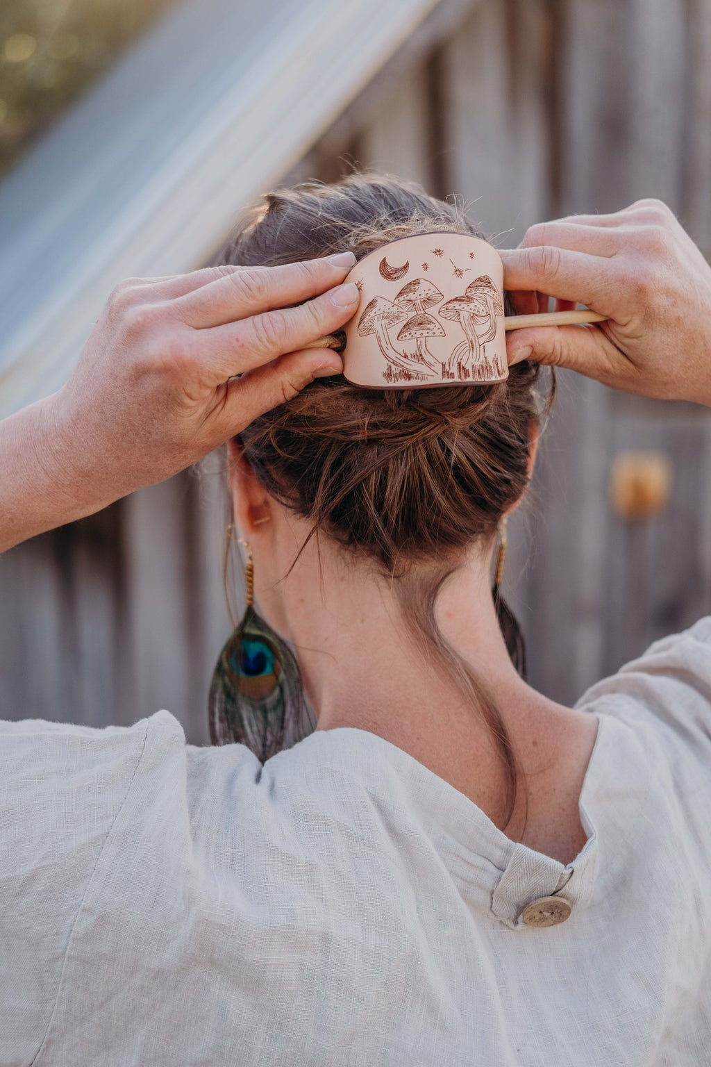The non-toxic leather barrette perfect gift for mystic women and nature lovers with its laser engraved artistic rendering of mushrooms under the night sky. 