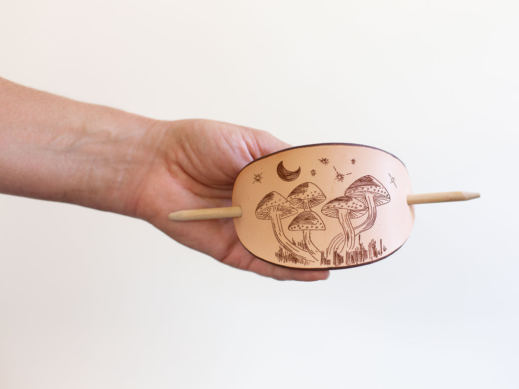 The leather hair clip has a mushroom laser engraving and is a perfect gift for women who are mystic, love mushies, the outdoors and nature. 