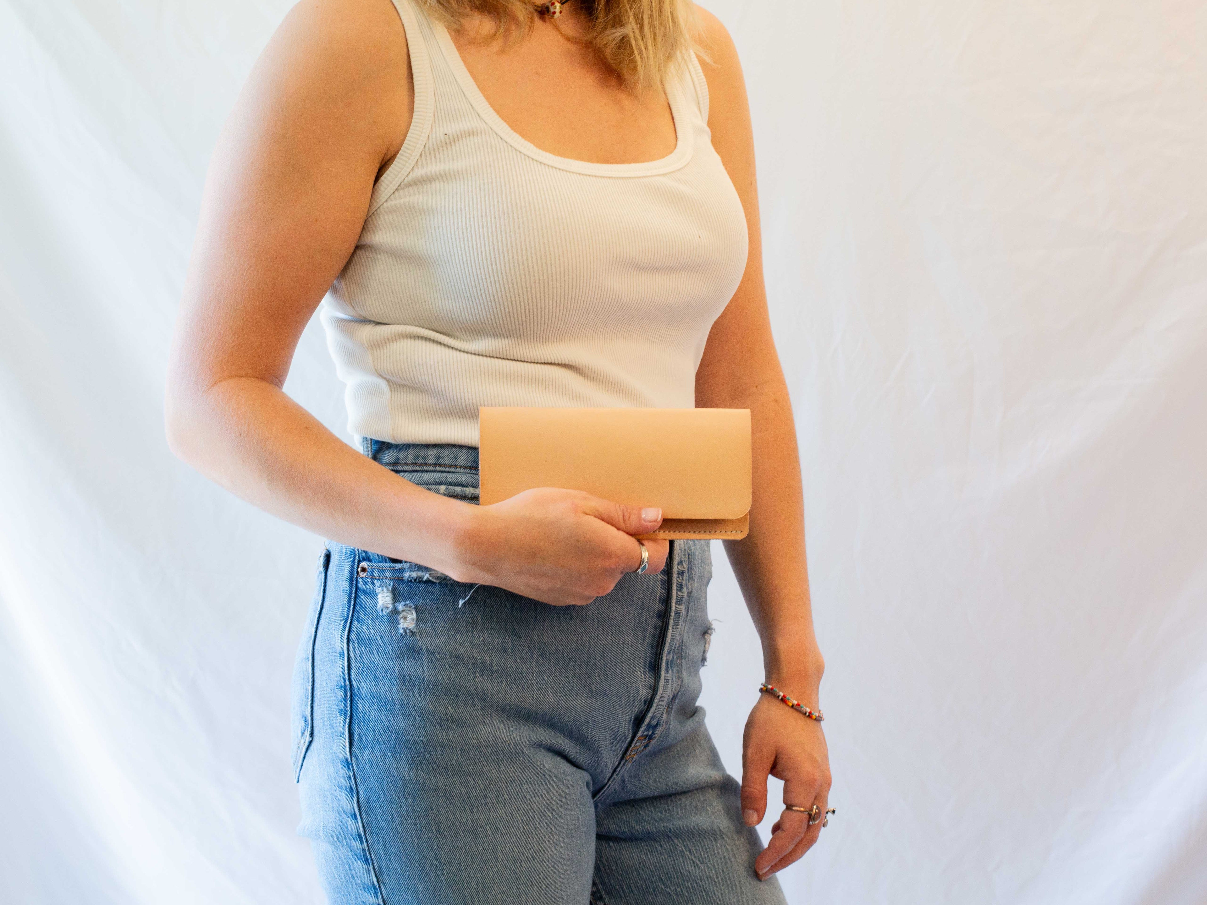 The leather wallet folds over once and has one card pocket. 