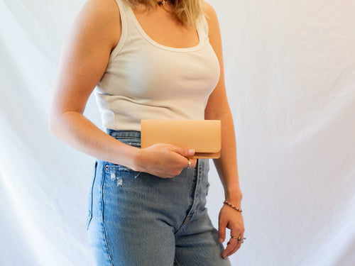 The leather wallet folds over once and has one card pocket. 