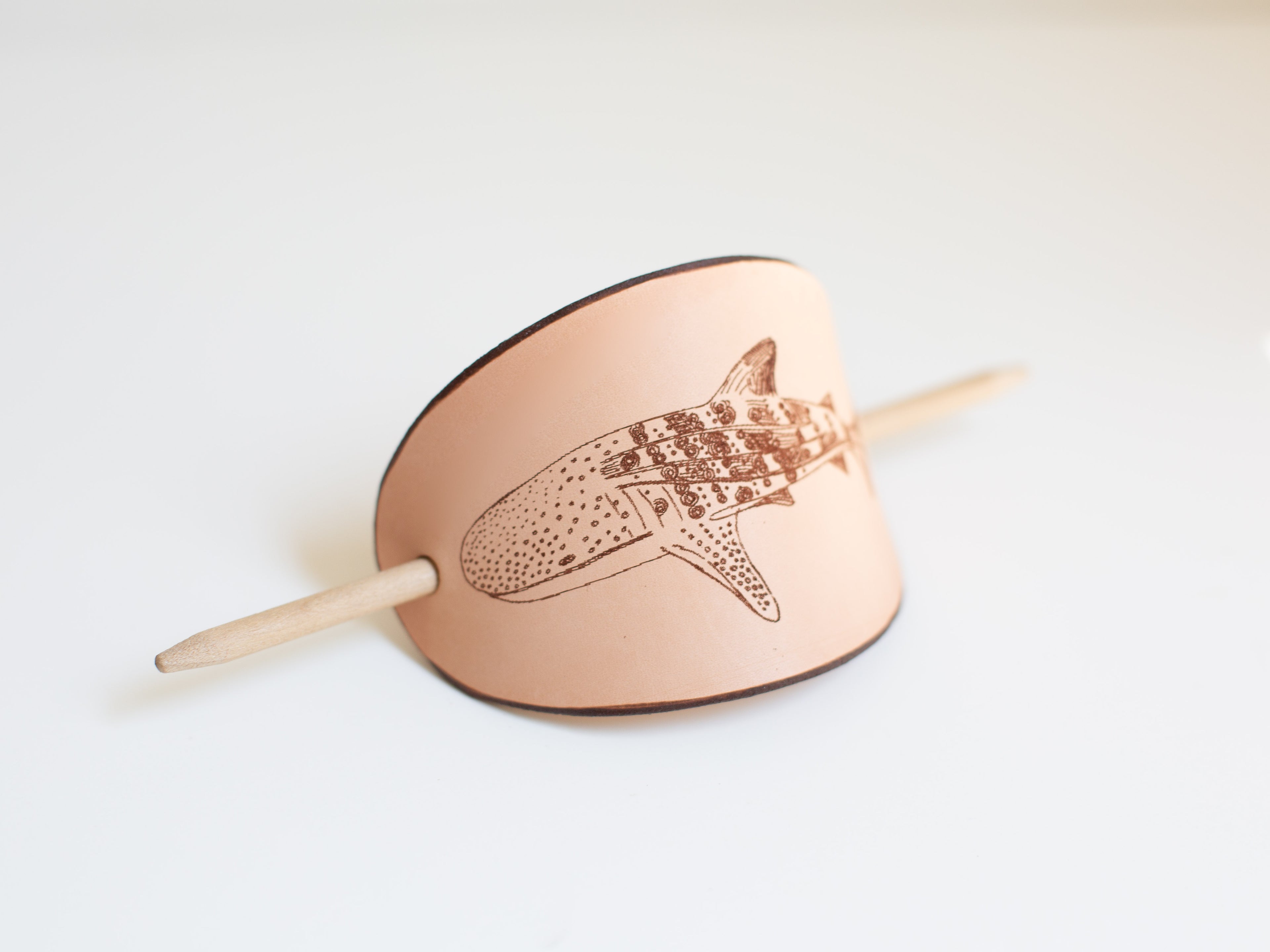The barrette is made with sustainable leather from organic farms and is large for long and thick hair and quick messy buns. 