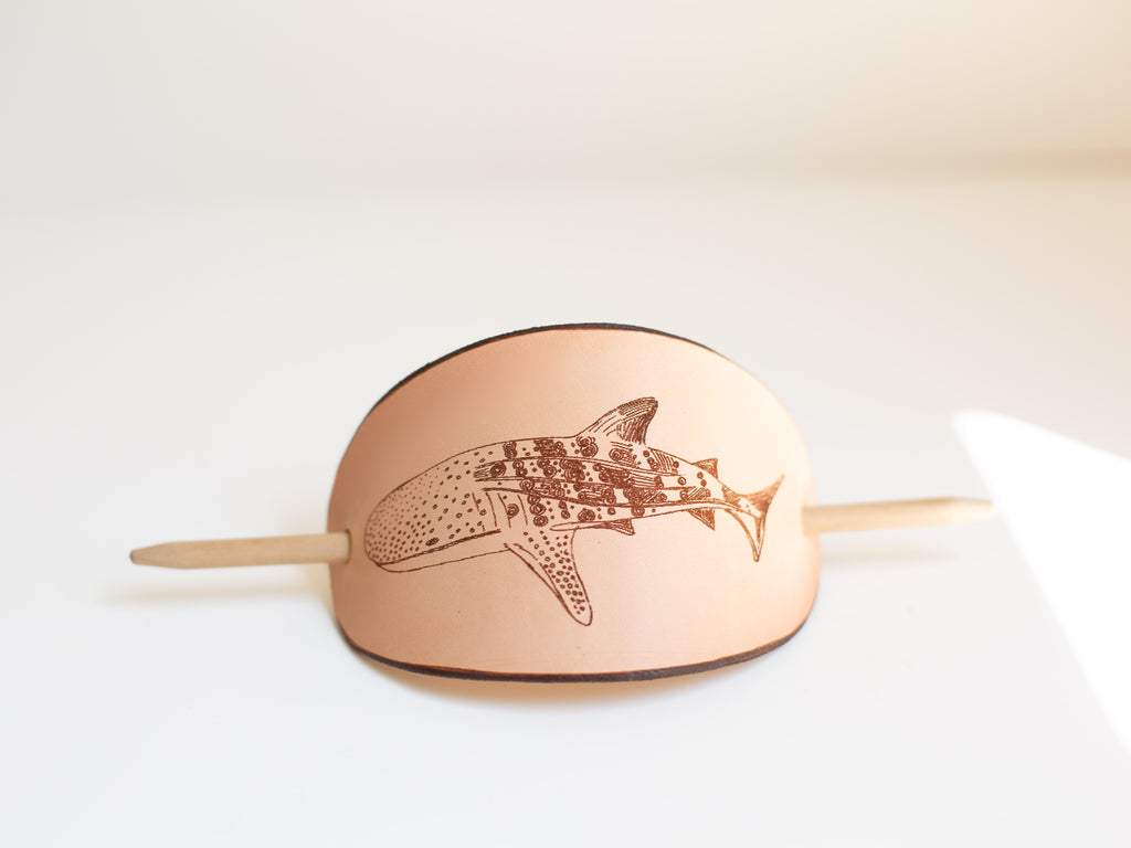 The large leather barrette has a laser engraved whale shark design that comes from an original art drawing. 