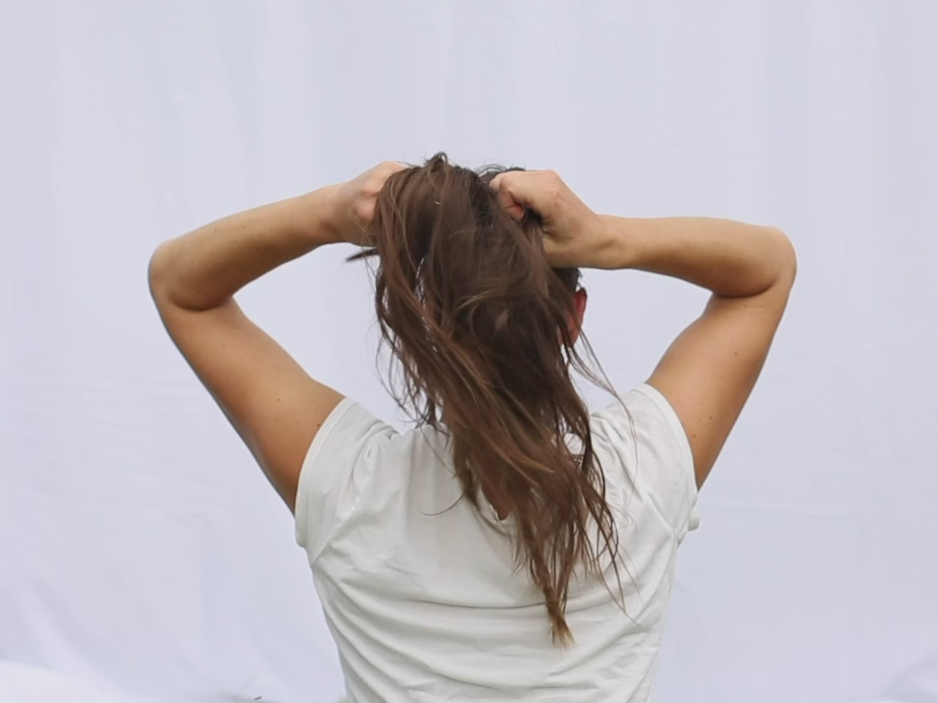 The short video is a tutorial on how to use a leather barrette or hair slide.